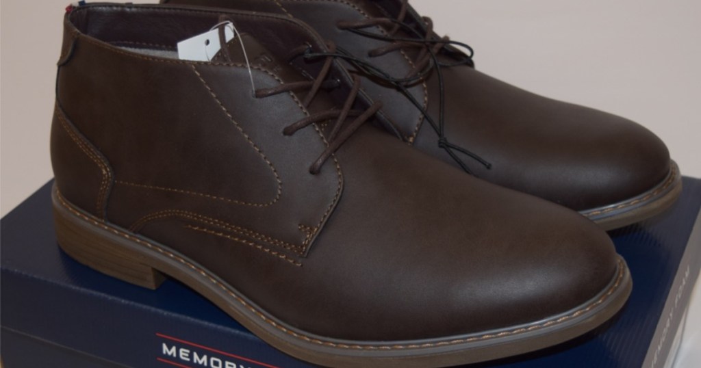 men's dark brown boots sitting on shoe box