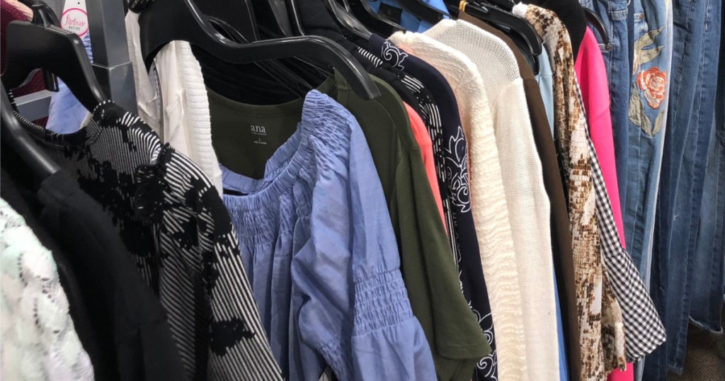 women's clothing hanging on rack in store