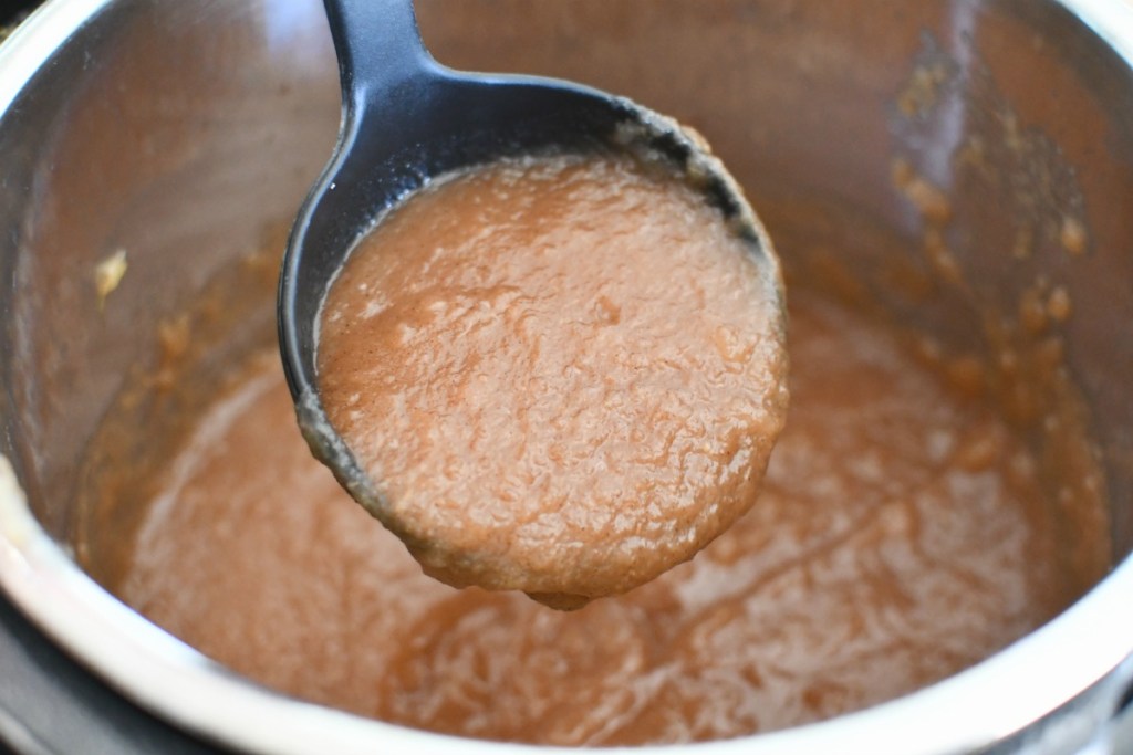 Large ladle with applesauce in the Instant Pot