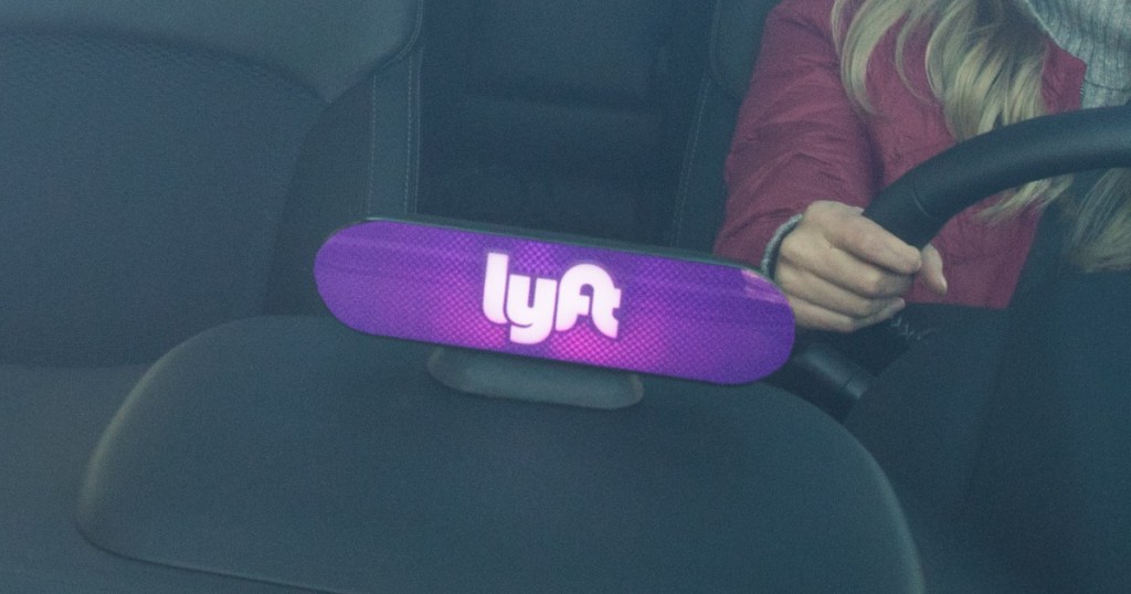 lit up Lyft sign on dashboard