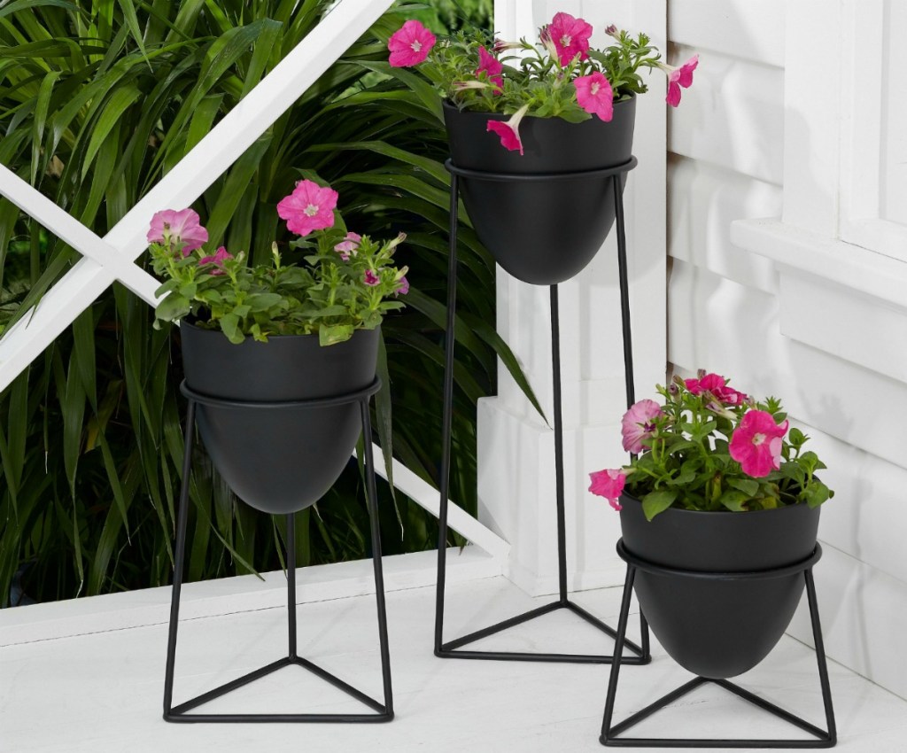 set of 3 dark metal planters full of flowers