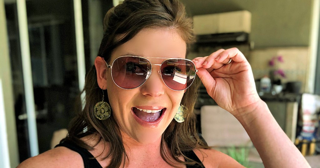 woman wearing Michael Kors Rodinara Aviator Sunglasses