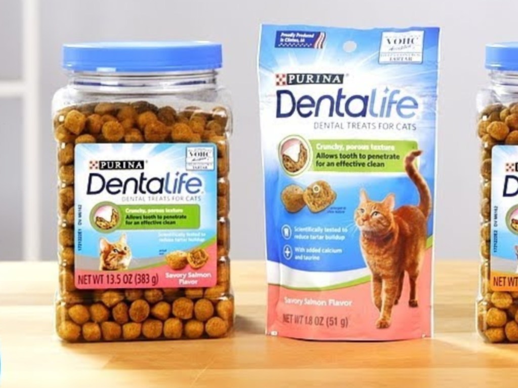 bag and canisters of cat treats on table