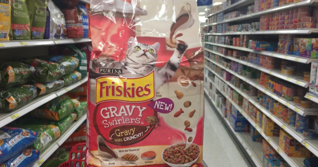 bag of cat food in cart in store aisle