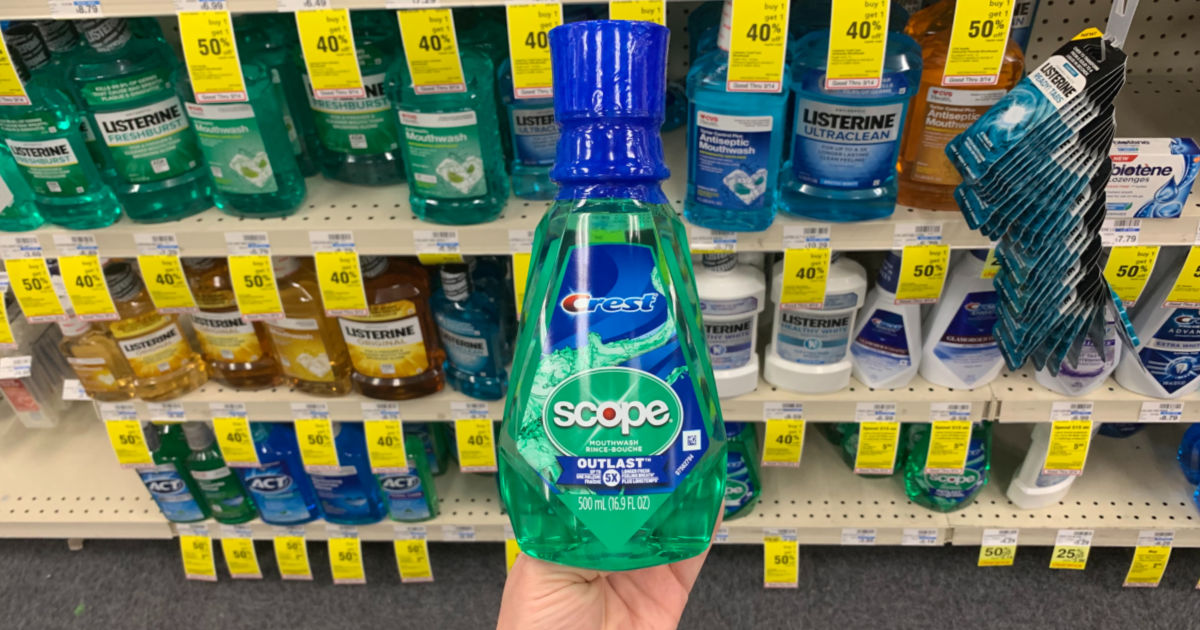 Hand holding Scope mouthwash 