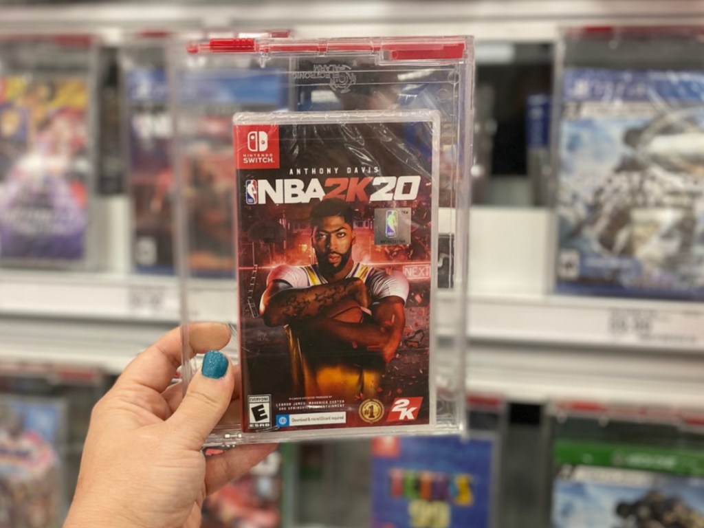 Hand holding NBA 2k20 for Nintendo Switch 