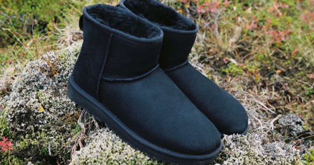pair of boots sitting on a rock