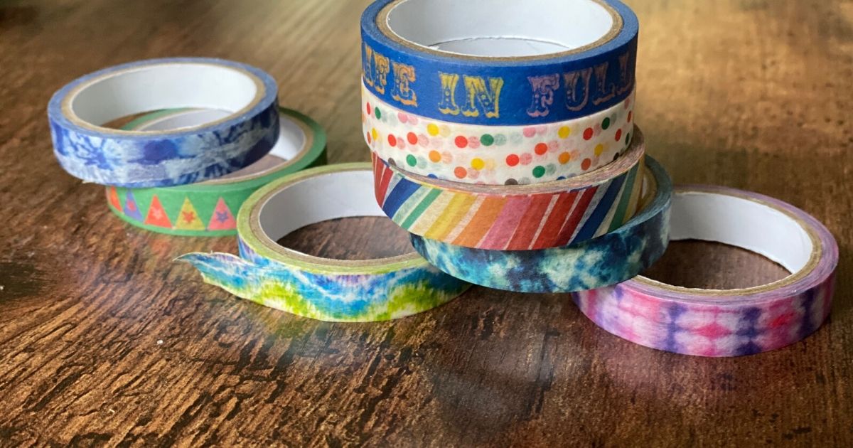Washi tape sitting on table for DIY car track