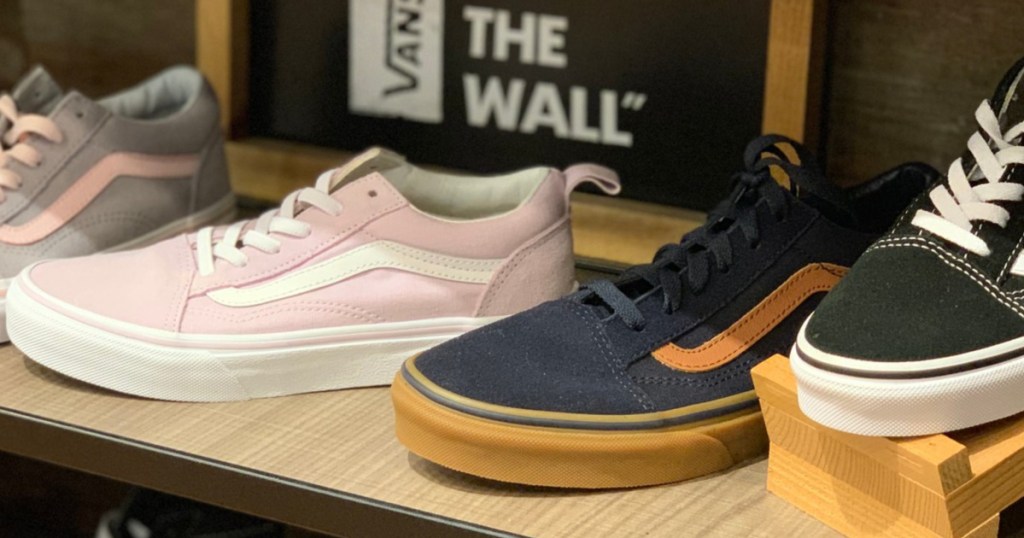men and women's casual shoes on store shelf display