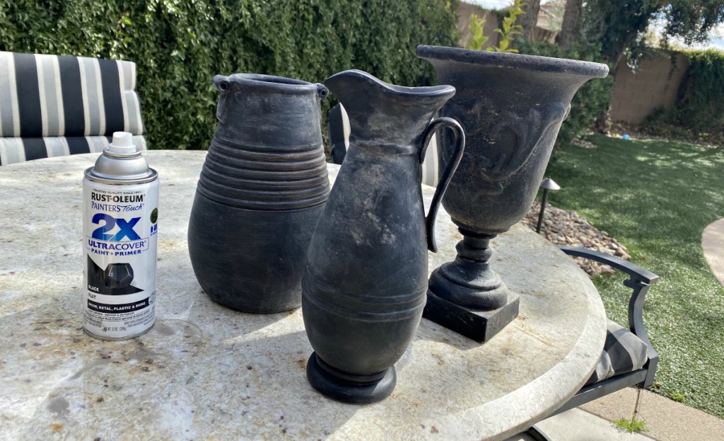 black pottery vases on a table