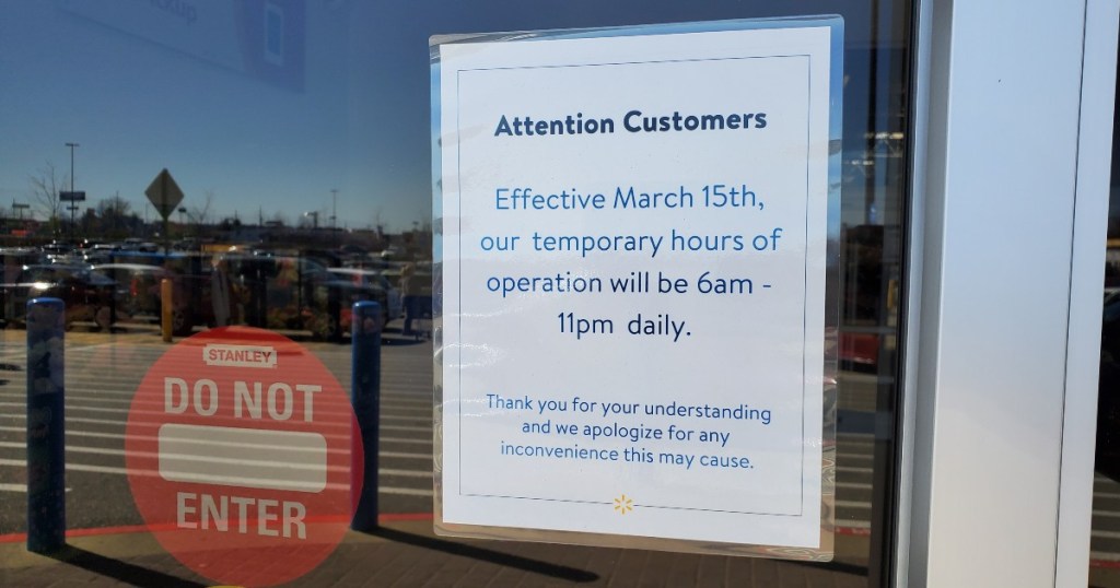 Sign indicating temporary hours at Walmart