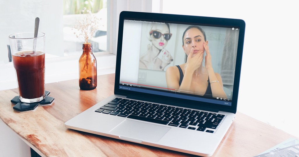 macbook laptop showing youtube video