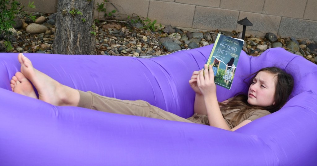 girl reading in an air sofa