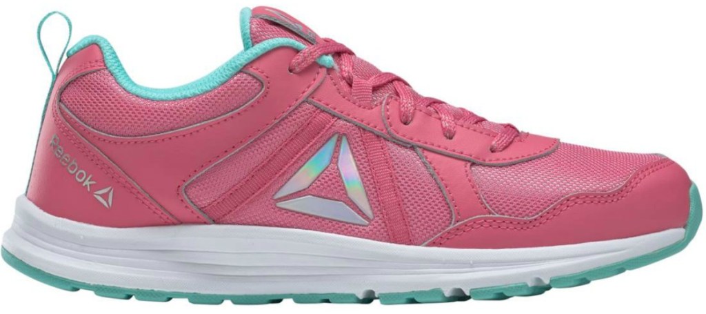 pair of girls pink shoes with Reebok logo