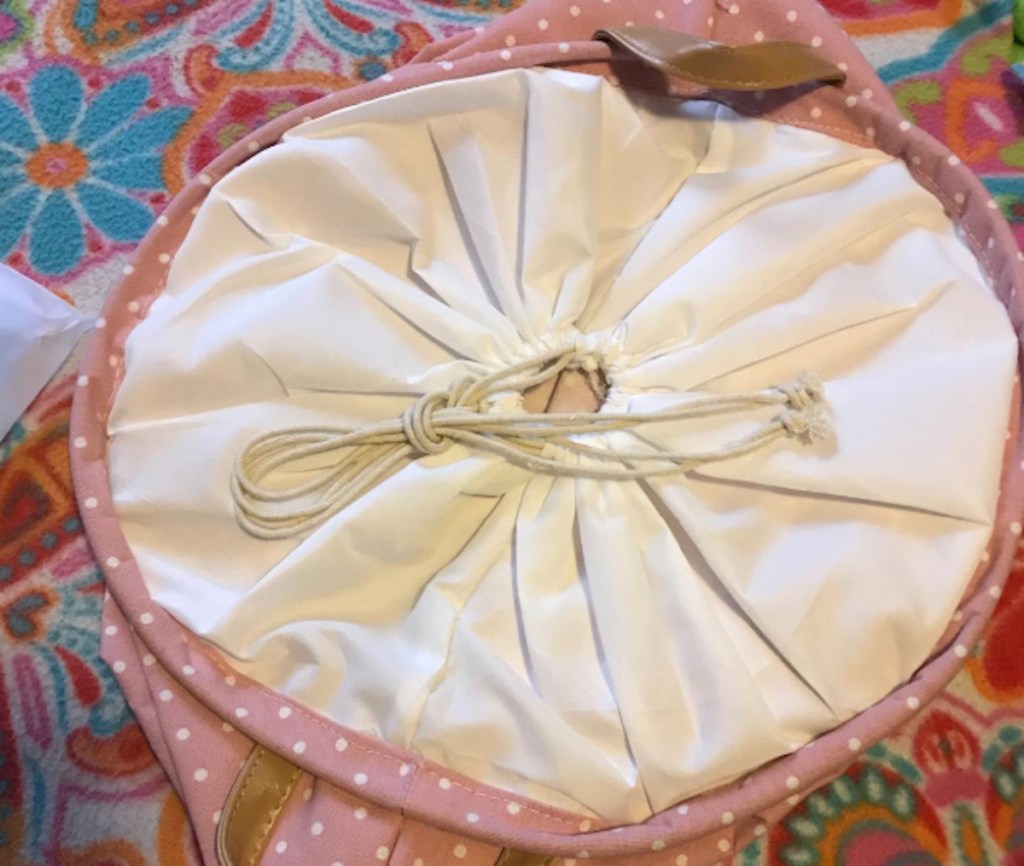 drawstring lid to pink hamper 