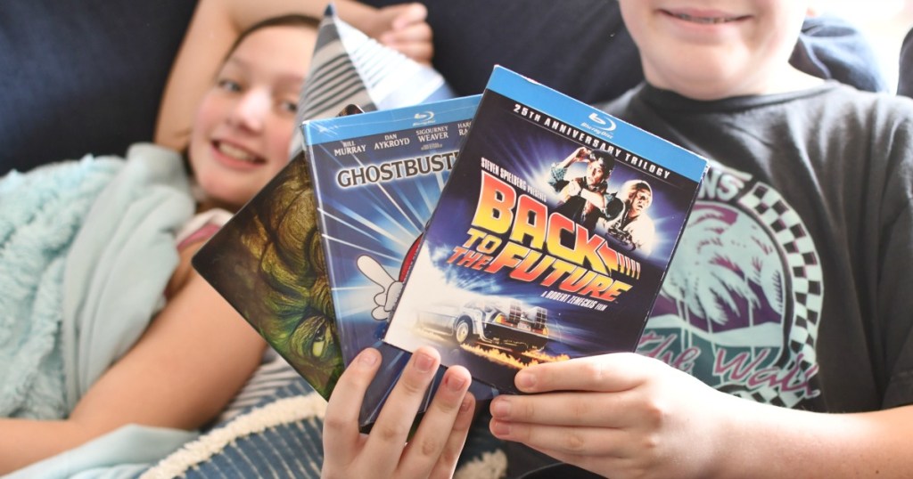 kids holding dvd movies