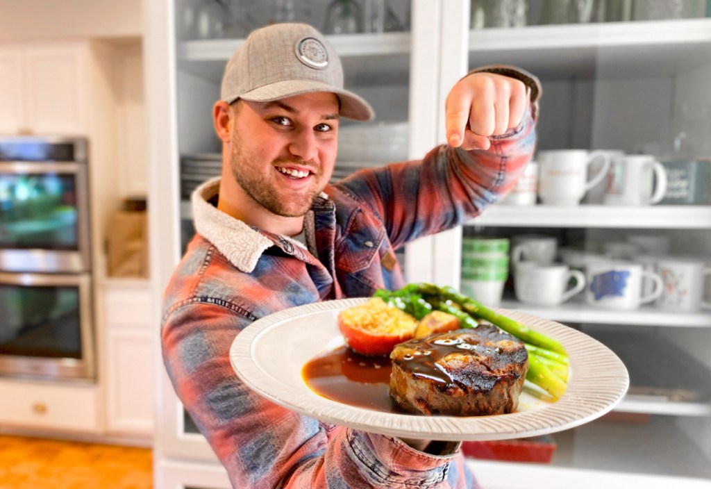 man holding plate