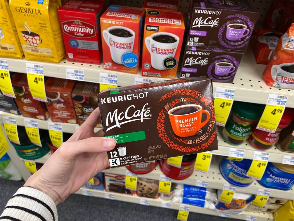 hand holding mccafe k-cup coffee pods