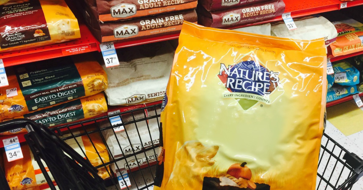 bag of dog food sitting in a store cart