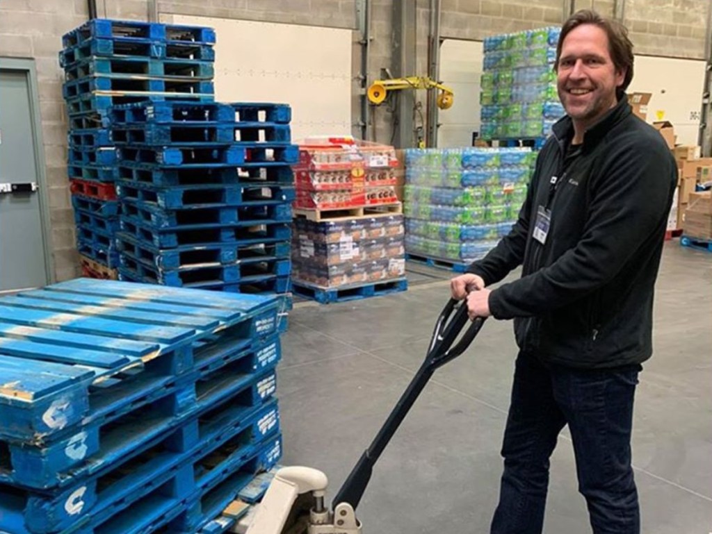 Sam;s Club employee with pallet jack