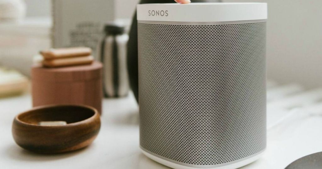 countertop with white wireless speaker and miscellaneous bowls