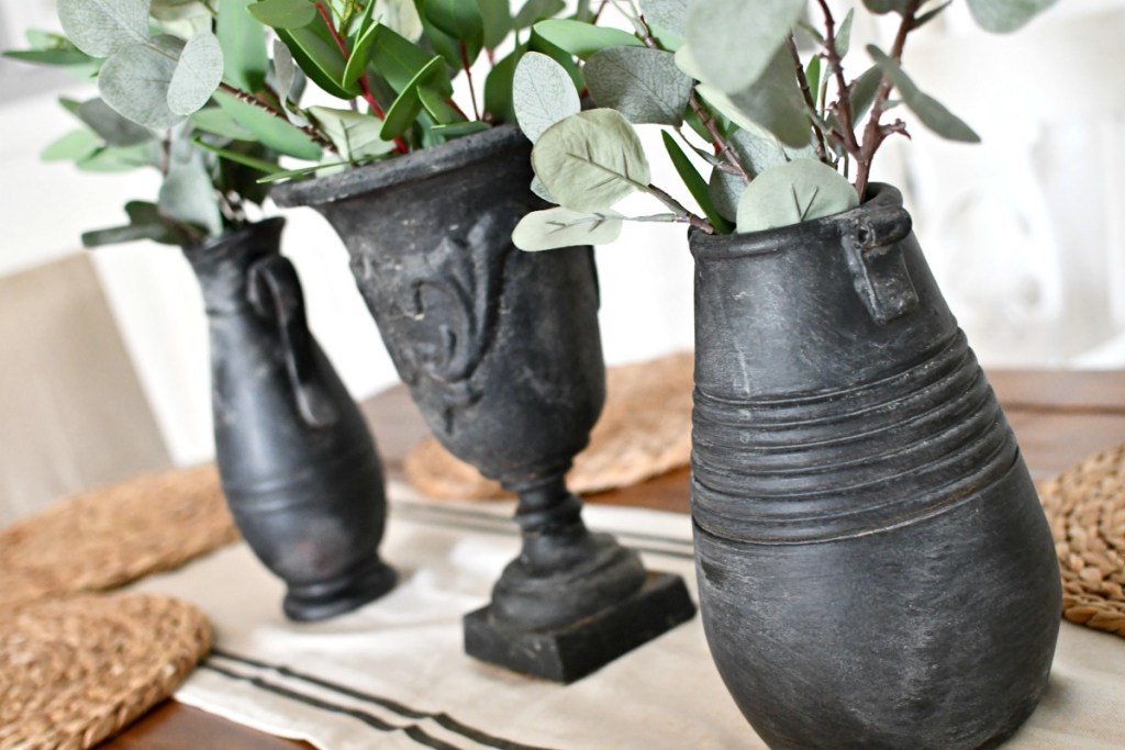 spray paint and dirt covered vases