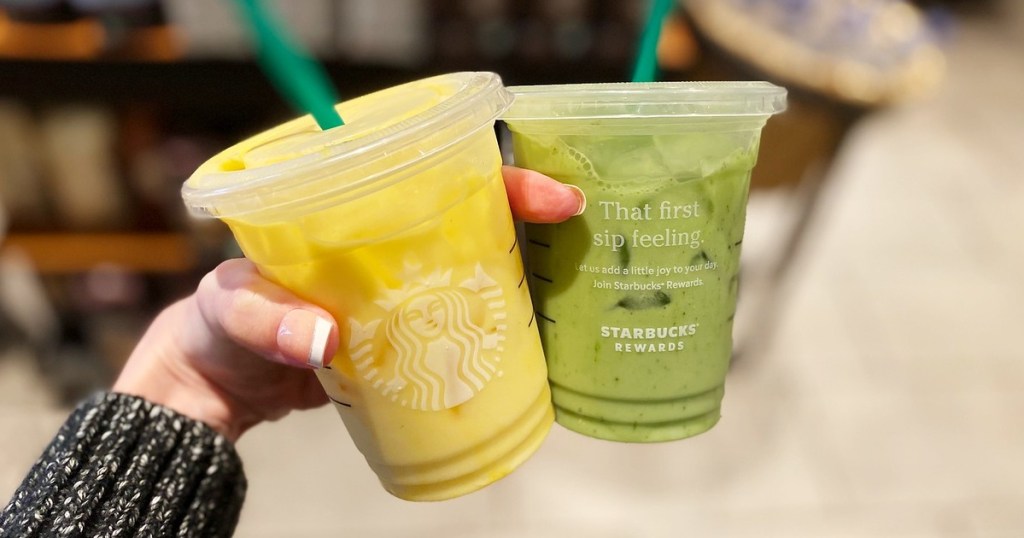 hand holding yellow and green cold drinks