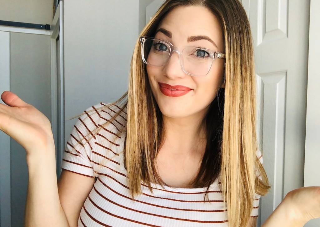 woman wearing clear colored frame glasses