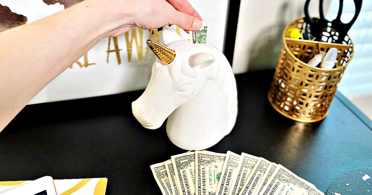 woman putting dollar bills in unicorn piggy bank - stimulus check