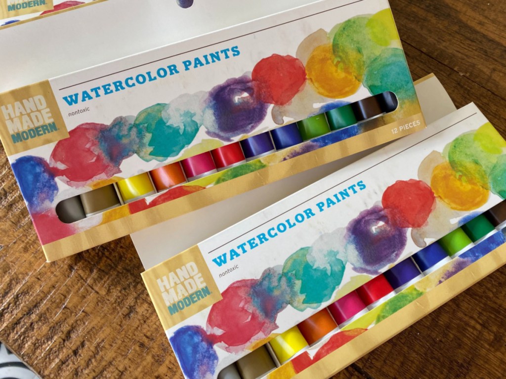 watercolor pain sets on wood table