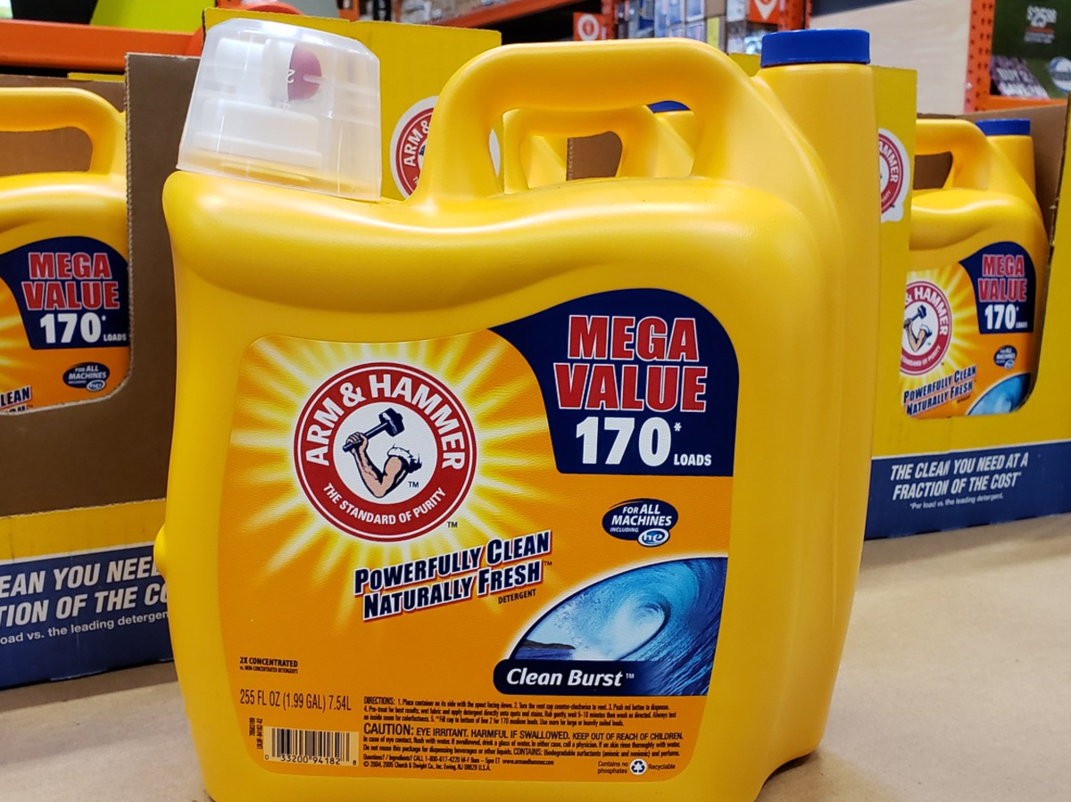 huge yellow bottle of detergent sitting on counter in store