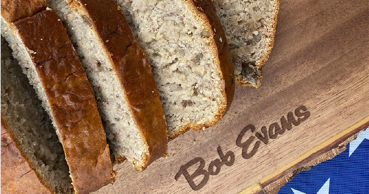 sliced banana nut bread on a cutting board marked with bob evans