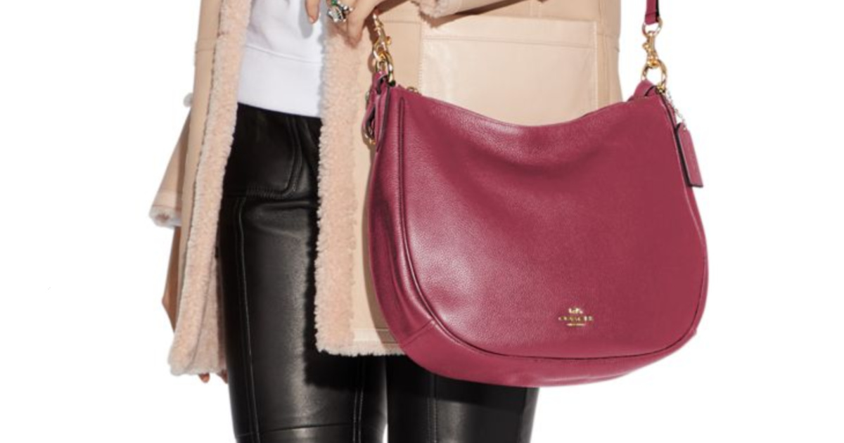 woman with red/pink hand bag