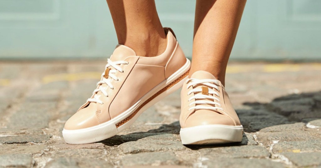 person wearing pink and white shoes