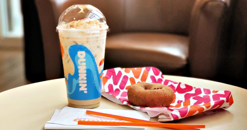 Dunkin donuts drink and donut on table