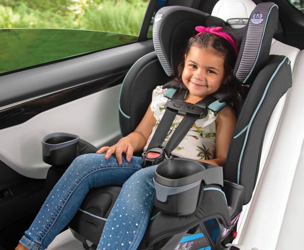 toddler girl in a car seat