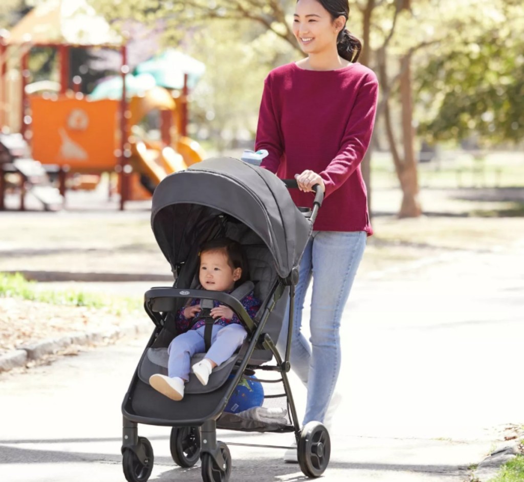 woman pushing a baby in a stroller
