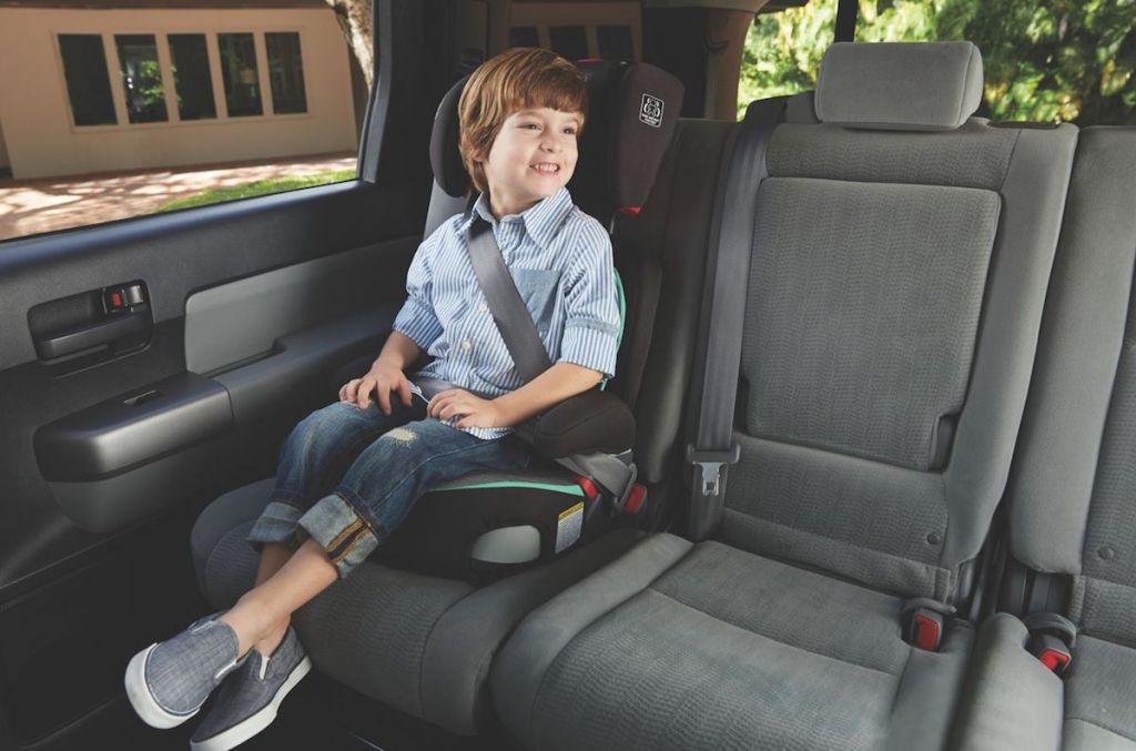 boy sitting in a carseat