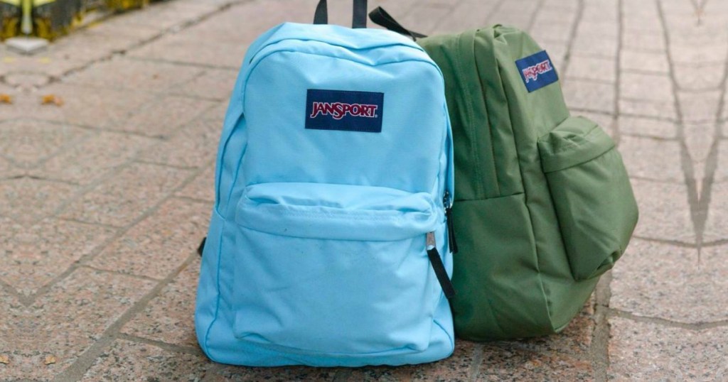 2 Jansport backpacks on sidewalk