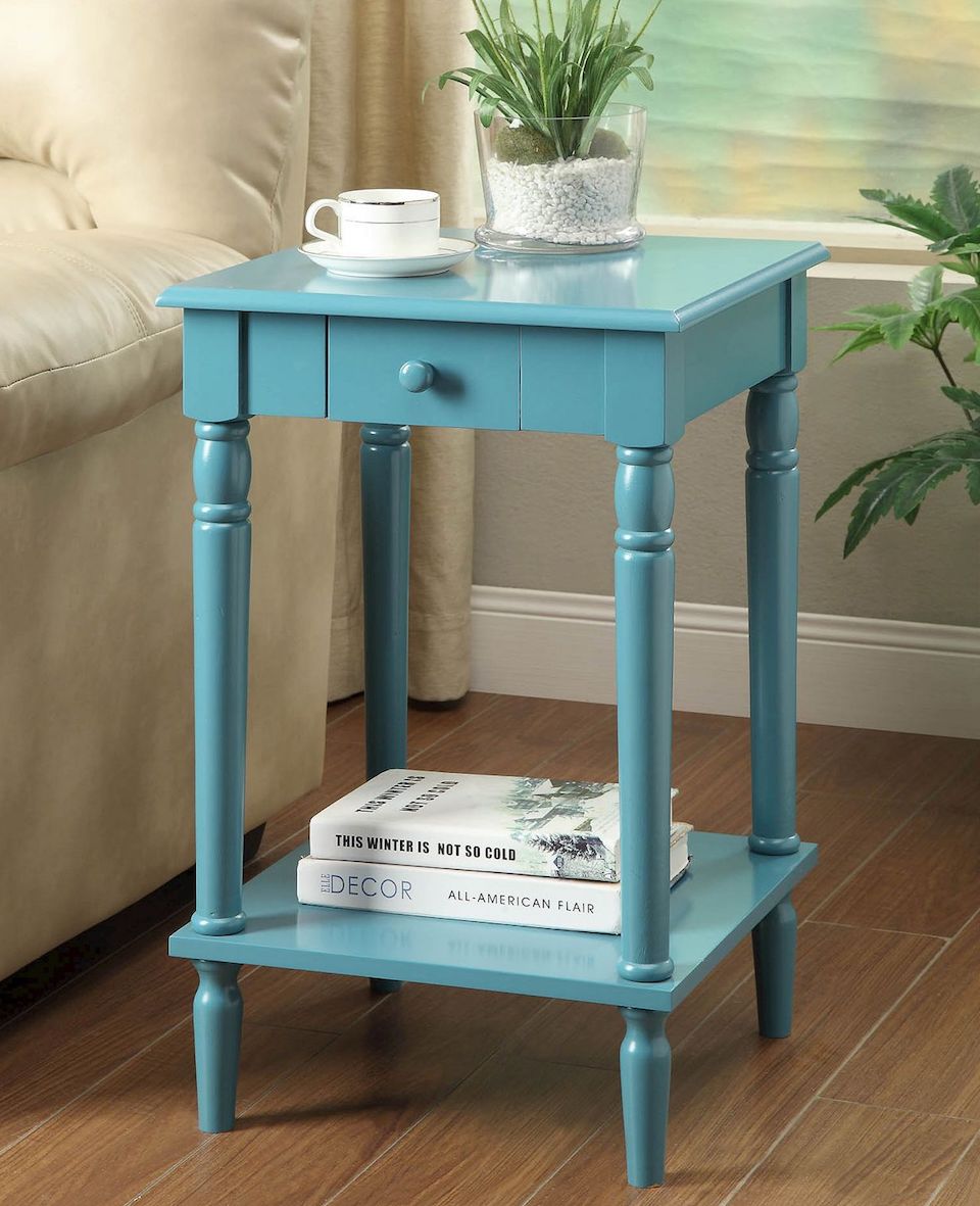 accent table with coffee and plant on top