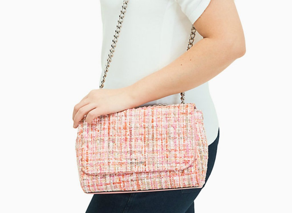 woman holding pink purse