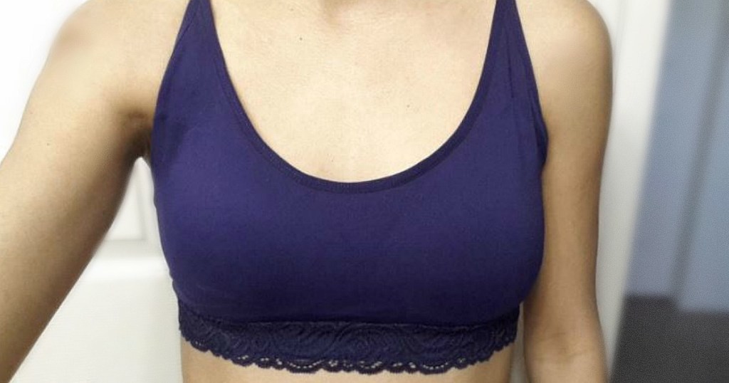 woman wearing sports bra in bathroom