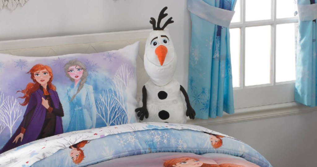 olaf stuffed animal on bed