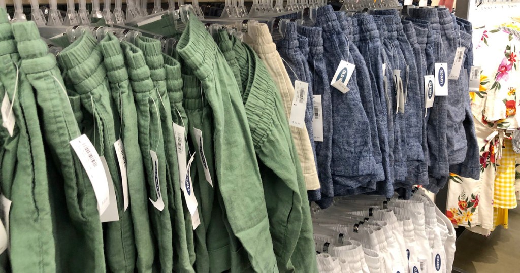 store display racks of womens shorts in olive green and blue colors