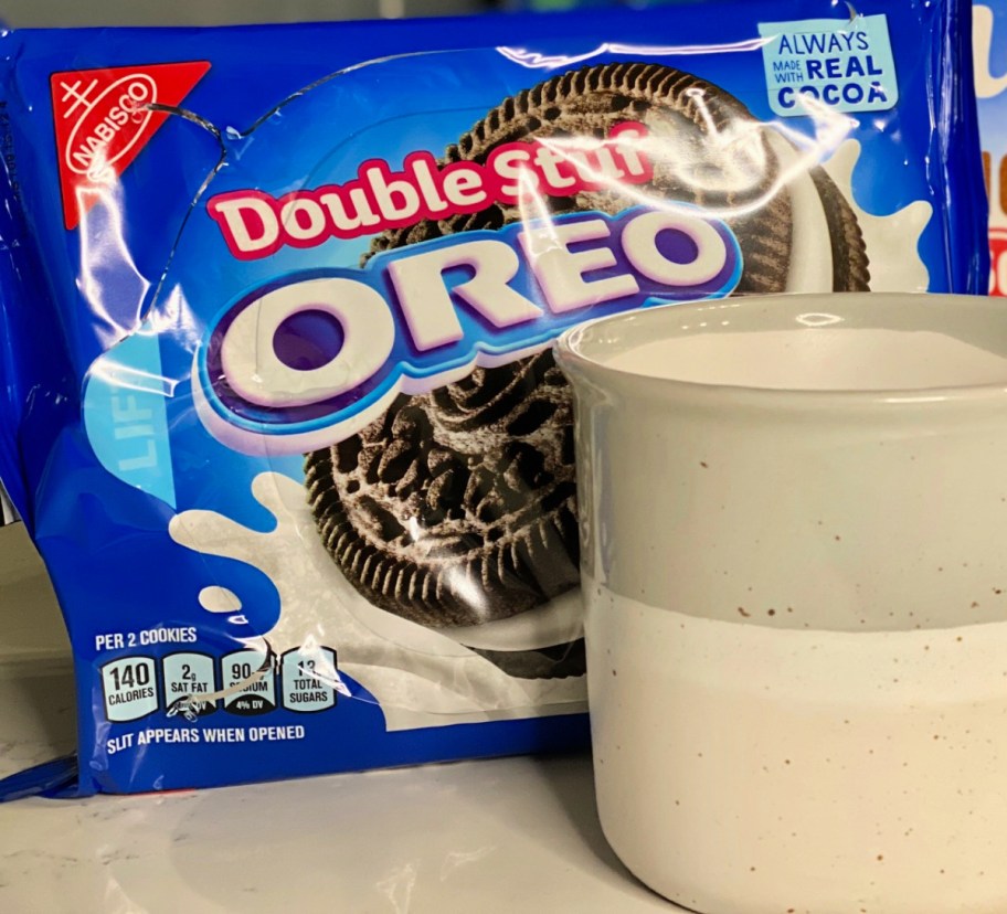 a package of cookies next to a coffee cup