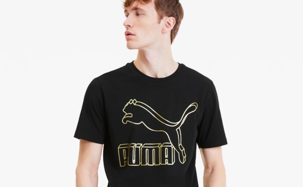 man wearing a PUMA logo tee
