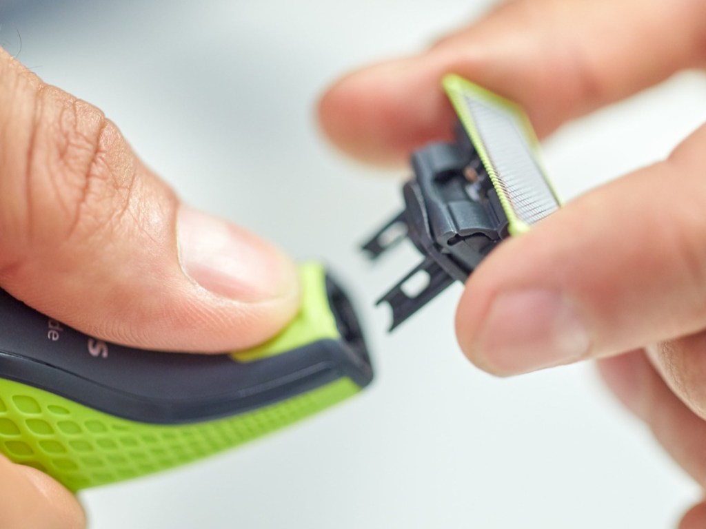 hand holding razor blade refills