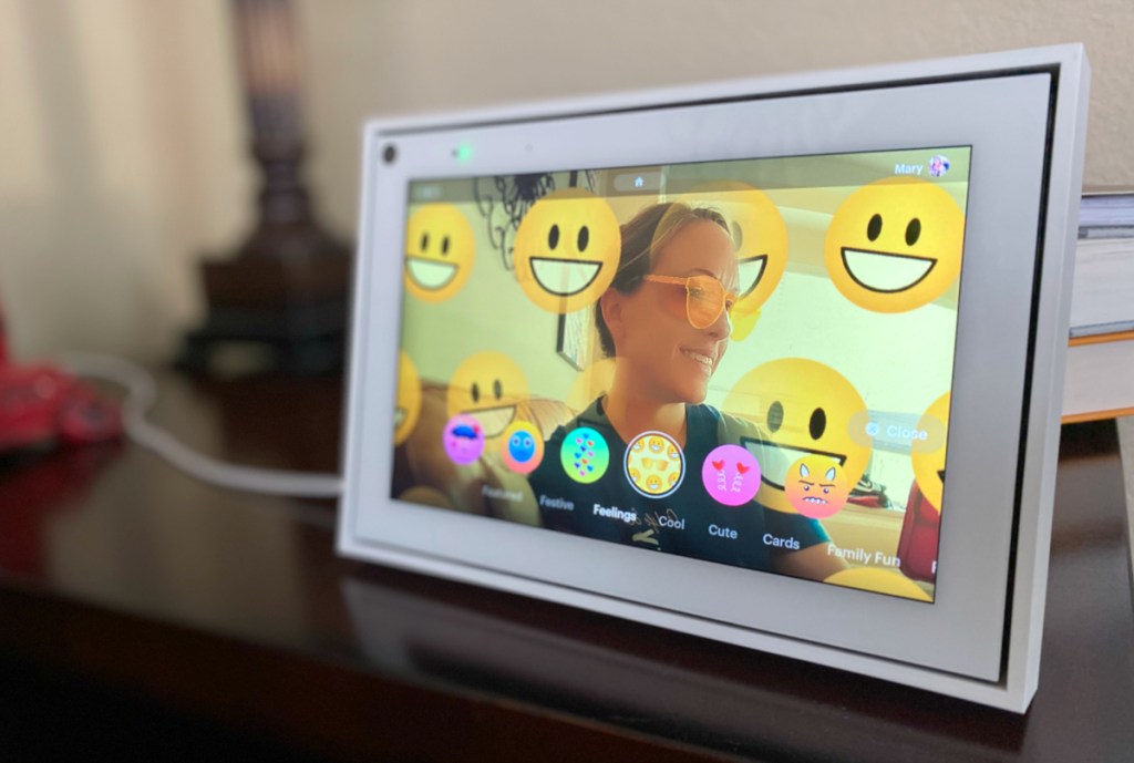 woman with smiling emoji filter