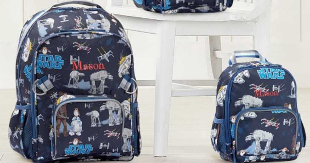 two pottery barn kids star wars backpacks sitting next to each other on the floor