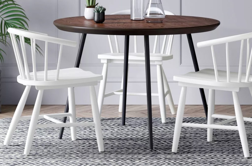 white wooden dining chairs at brown table